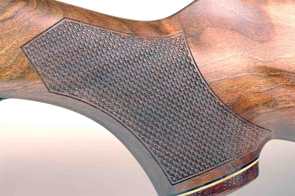 Checkering panels on the rifle’s grip and forend are wide and cut with a border.